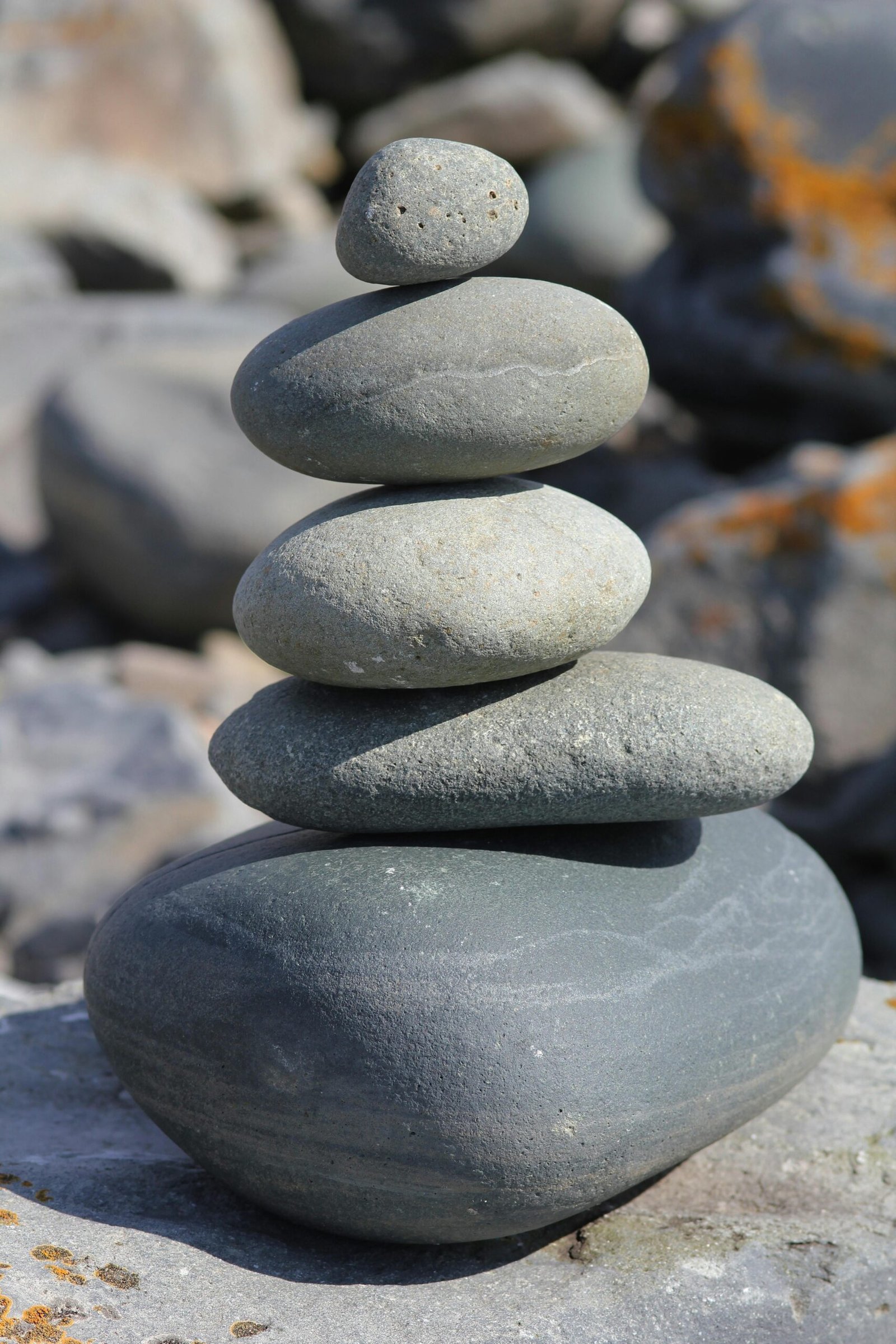 Stacked stones create a harmonious balance, exemplifying simplicity and tranquility in nature.